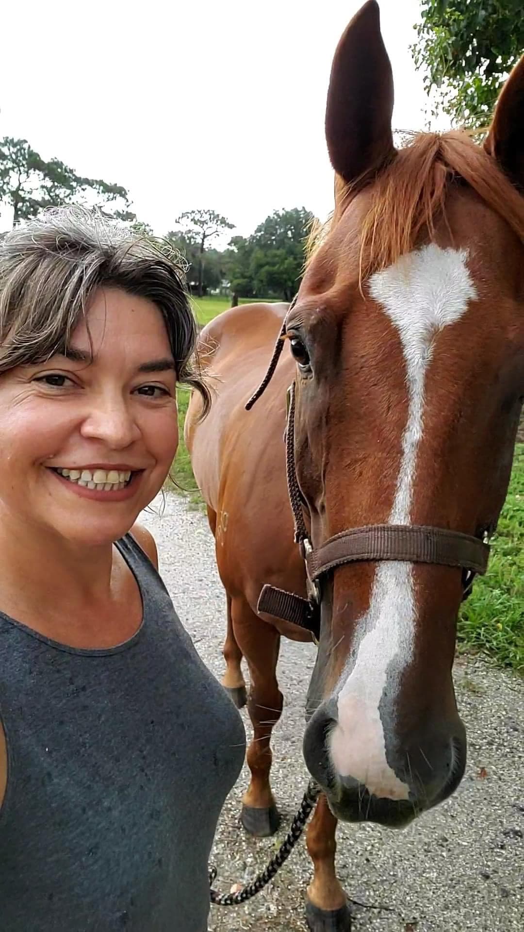 Sara Kirkwood with her chestnut horse